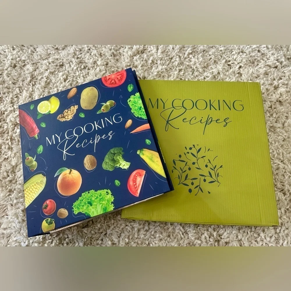 Recipe book with page protectors, dividers, and labels. New in box 11 x 11.5”